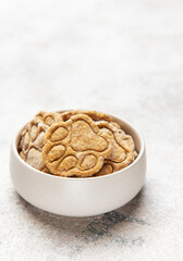 Homemade paw print dog treats in bowl