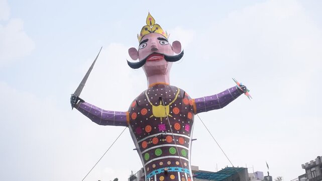 Ravnans being ignited during Dussehra festival at ramleela ground in Delhi, India, Big statue of Ravana to get fire during the Fair of Dussera to celebrate the victory of truth by Lord Rama