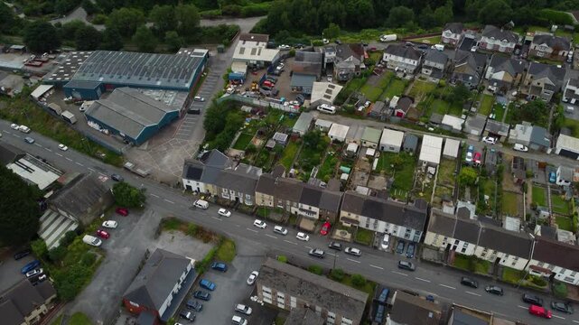 Tilted drone fly at Neath Abbey suburban district toward the Tennant Canal, Wales, United Kingdom, UK