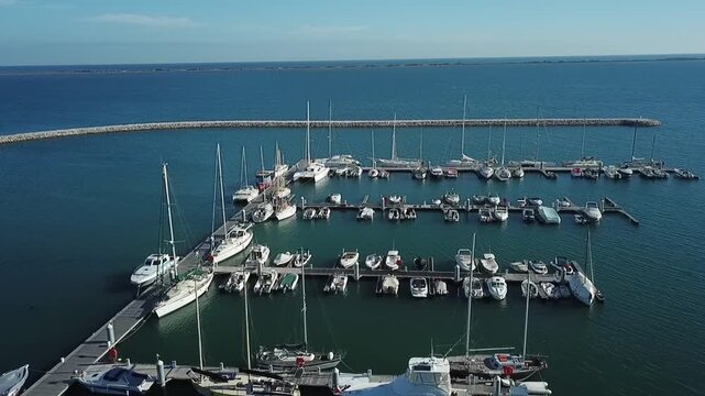 Drone footage of the recreational marina in Al Hoceima. Features leisure boats, yachts, and the harbor infrastructure on the Mediterranean coast.