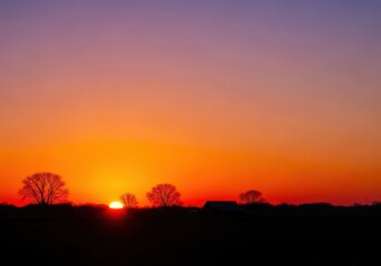 Fototapeta premium Tranquil landscape bathed in the warm, fading light of the golden hour sunset. Silhouettes of trees and structures mark the approach of dusk, ambient, serene, fading light