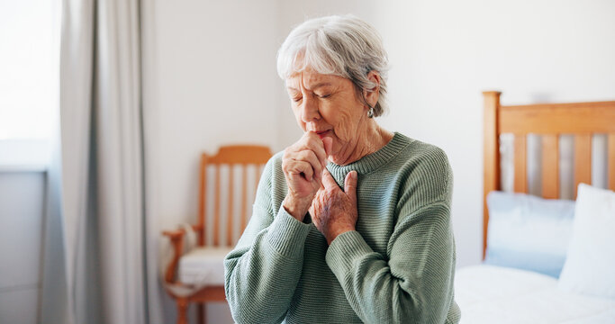 Cough, sick and senior woman on bed in home with allergies, chest infection or sore throat. Illness, retirement and elderly female person with tuberculosis, cold or flu symptoms in bedroom at house.
