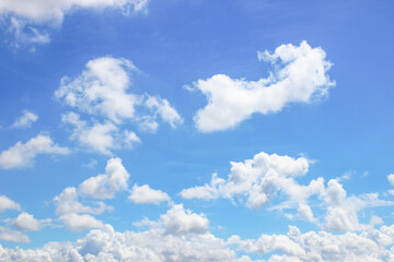 Fototapeta premium Beautiful blue sky with fluffy white clouds on a bright, clear summer day