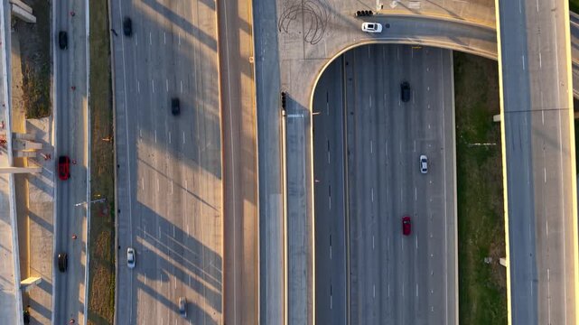 Top down view of traffic moving on highway with several lanes of the roads in Dallas, Texas