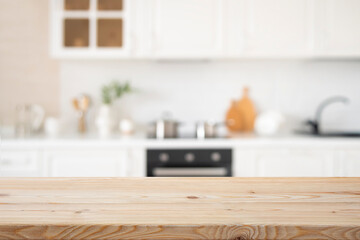 Kitchen furniture interior as blurry background for empty wooden table top cooking space or product presentation