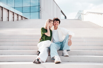 Smiling beautiful woman and her handsome boyfriend. Couple in casual summer clothes. Happy cheerful...