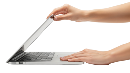 Close-up shot of a person's hands opening a silver laptop computer on a white surface.