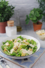A bowl with classic Caesar salad	