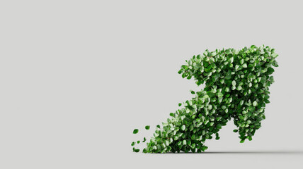 Green arrow made of leaves pointing upwards, symbolizing growth and development. The arrow is composed entirely of lush, green foliage, signifying environmental sustainability and progress