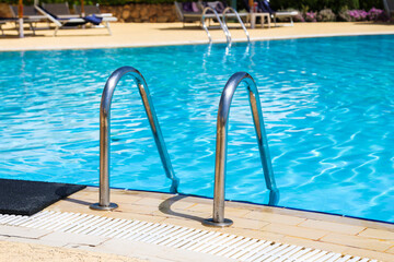 Handrails  iron staircase to the pool.