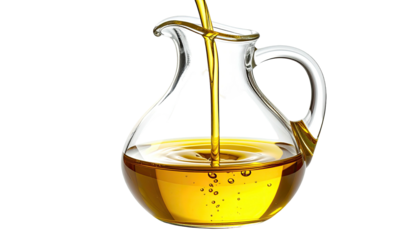 A clear glass pitcher pouring golden liquid. Light reflects, creating a shiny and transparent look