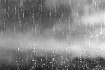 Abstract monochrome art features heavy rainfall cascading from a cloudy sky