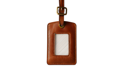 A close-up shot of a brown leather luggage tag with a blank information window and brass buckle isolated on white background