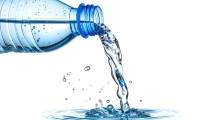 A clear plastic bottle pours a stream of water with a slight blue tint against a black background