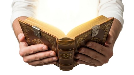 Hands hold open a vintage book emitting golden light centered on a white background