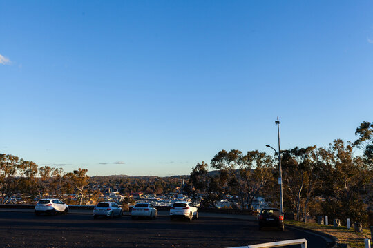 Cars parked at Drummond Apex Lookout overlooking city of Armidale