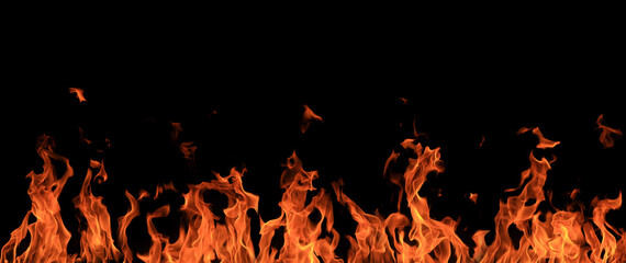 High-contrast flames rising against a pure black background, showcasing intense heat, energy,...