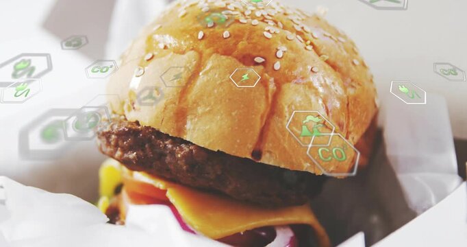 Camera sliding, revealing takeout burger centering while green hexes growing, highlighting toppings