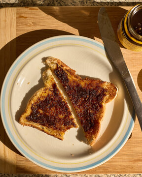 Yeast extract on toast with bite taken out