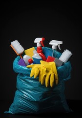 Household cleaning supplies being crammed into a disposal sack, symbolizing the end of boring daily chores and tasks and newfound relief ,broom ,housework ,tidy