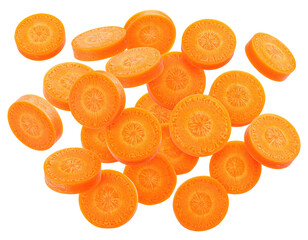 Scattered, freshly sliced carrot rounds on a stark black background