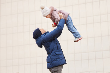 Father and daughter enjoying a playful moment, showing family love and connection