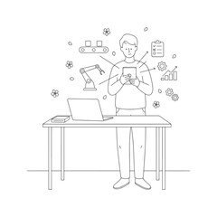 A man is standing in front of a desk with a laptop and a tablet. He is looking at the tablet and he is focused on something. The desk is cluttered with various items, including a keyboard, a mouse