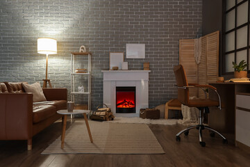 Obraz premium Interior of living room with fireplace, sofa and workplace