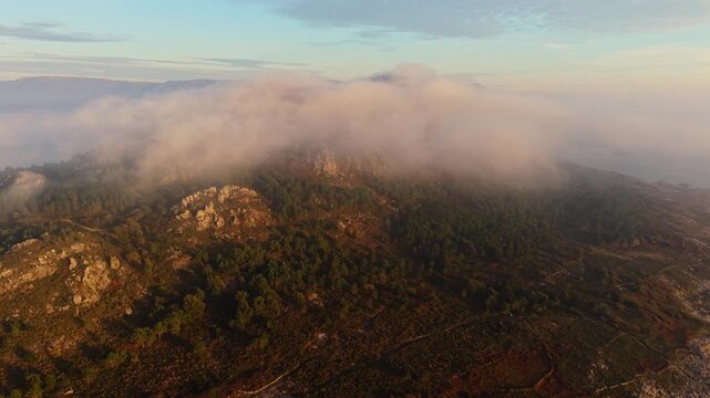 Clouds At The Rock Mountains Of Miradoiro Monte Louro In Galicia, Spain. Aerial Drone Shot