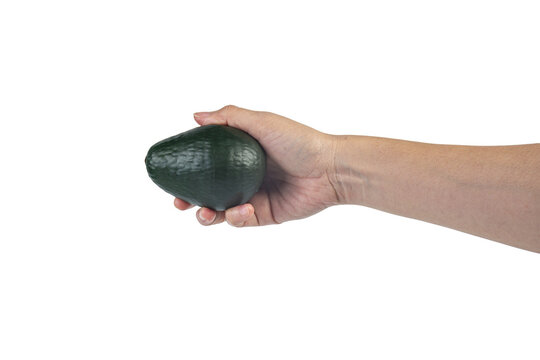 Avocado and hand isolated on transparent background close-up.