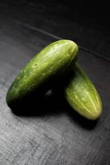 Cucumbers on a wooden background
