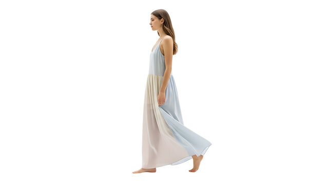 A young woman walks barefoot wearing a flowing pastel color-block maxi dress on a black background