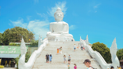 Phuket Big Buddha statue. afternoon light sky and blue ocean are on the back of white Phuket big Buddha is the one of landmarks on Phuket island Thailand.