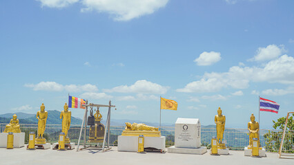Phuket Big Buddha statue. afternoon light sky and blue ocean are on the back of white Phuket big Buddha is the one of landmarks on Phuket island Thailand.