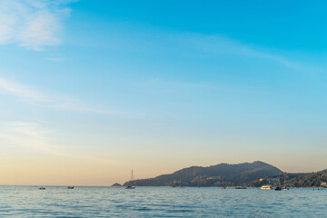 scene romantic sunset at Karon beach. abstract nature background..Sunset with bright color light rays and other atmospheric effects..Gradient color.cloudscape background in Phuket Thailand.