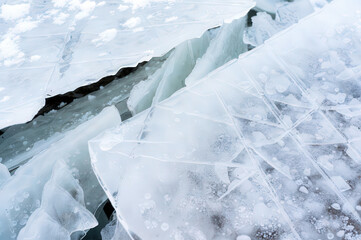 Detailed shot of cold-season ice textures with sharp crystal structures.