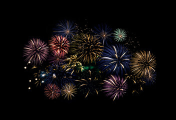 Fireworks of various colors and shapes burst in night sky