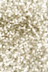 Silver Sparkling Lights Festive background with texture. Abstract Christmas twinkled bright bokeh defocused and Falling stars.