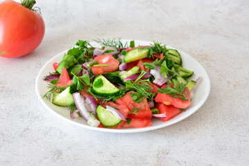 Fresh Summer Salad with organic Tomatoes, Cucumbers and Herbs