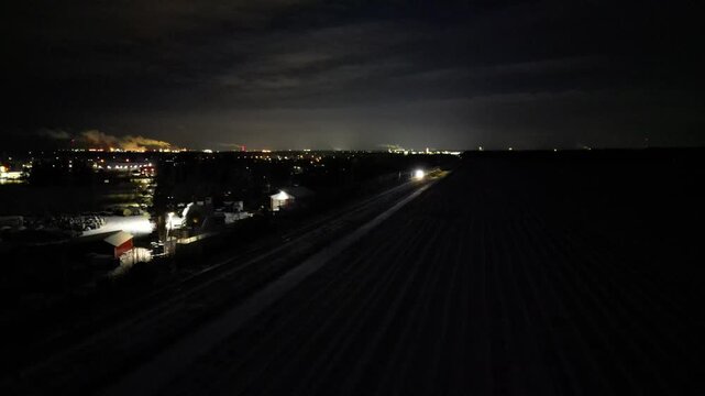 Aerial view of Pendolino train traveling in December darkness, Kempele Finland