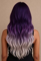 Fototapeta premium A back view of a person with long, wavy hair that has a beautiful purple and white ombre color transition.