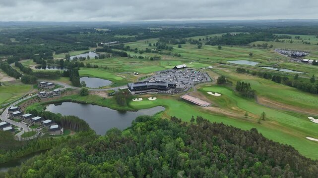 Aerial panorama of TPC Toronto at Osprey Valley showcasing rolling fairways, lakes, tree lines and the main clubhouse complex during an overcast day at this premier Canadian golf destination.