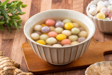 Colorful sweet glutinous rice balls tangyuan in sweet ginger syrup soup