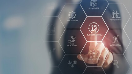 An executive interacts with a futuristic interface, highlighting Business Models, symbolizing innovation and strategic insight in a dynamic business environment.