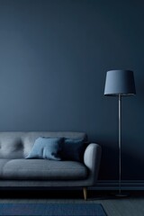 Modern living room interior with sofa pillows and floor lamp against a wall