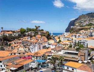 Aerial view of Camara de Lobos on Madeira Island. Cabo Girao cliff on background, Portugal