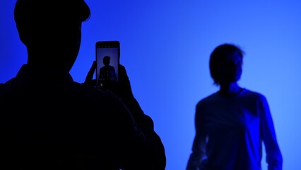 Backstage Silhouette Photo Shoot with Blue Background