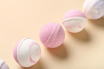 Row of different bath bombs on color background