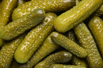 Texture of tasty pickled cucumbers as background