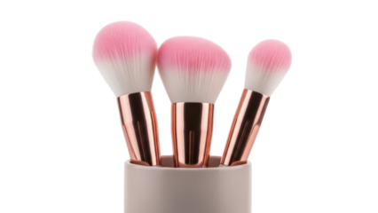 Three pink and white makeup brushes in a holder isolated PNG, beauty tools for applying cosmetics and creating flawless looks